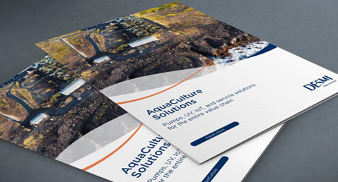 DESMI brochures titled "Aquaculture Solutions" on a gray surface.