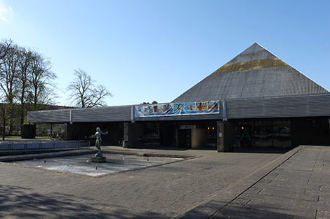 Industrial pumps and pipes in a facility for fluid handling operations.