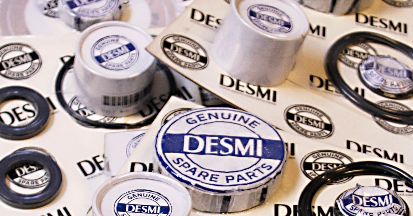 DESMI genuine spare parts packaging with seals and labels displayed.